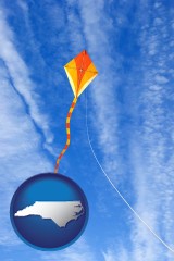 north-carolina map icon and flying a kite
