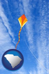 south-carolina map icon and flying a kite